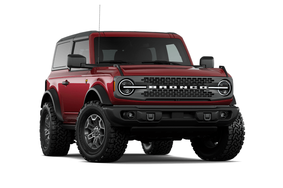 2026 Ford Bronco Badlands in Ruby Red Metallic, front three-quarter studio view.